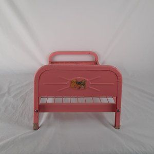 Vintage pink metal Doll-E-Bed from the 1950's